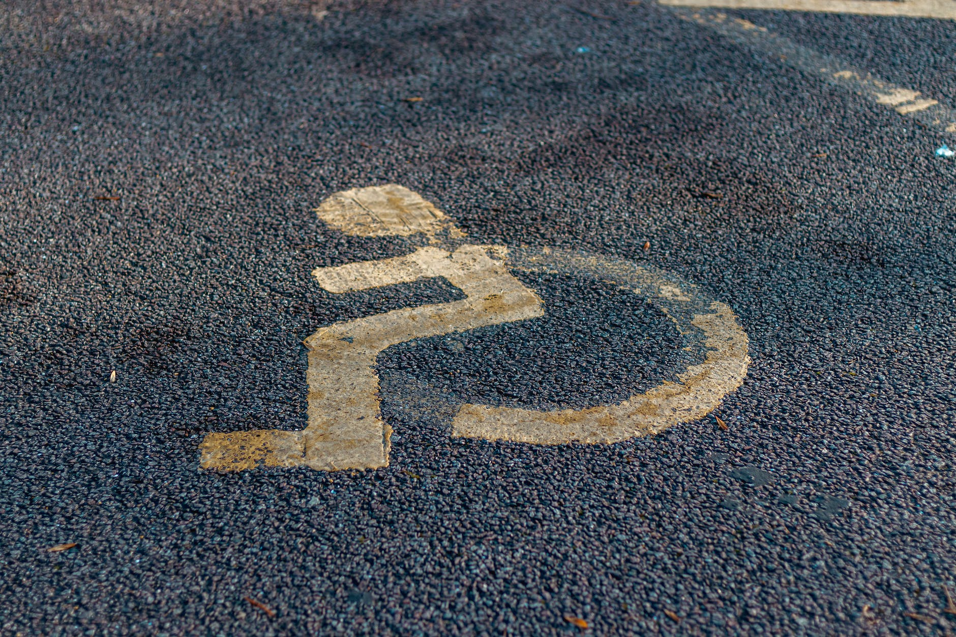close up photo of a handicap road marking