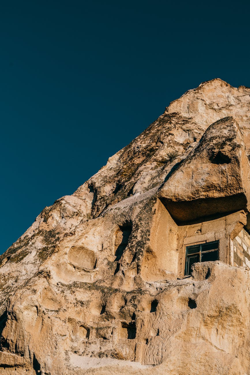 old rock with window in cappadocia town